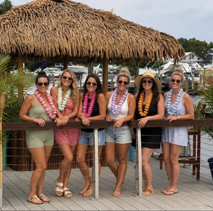 A group of friends enjoying a celebration on the tiki boat